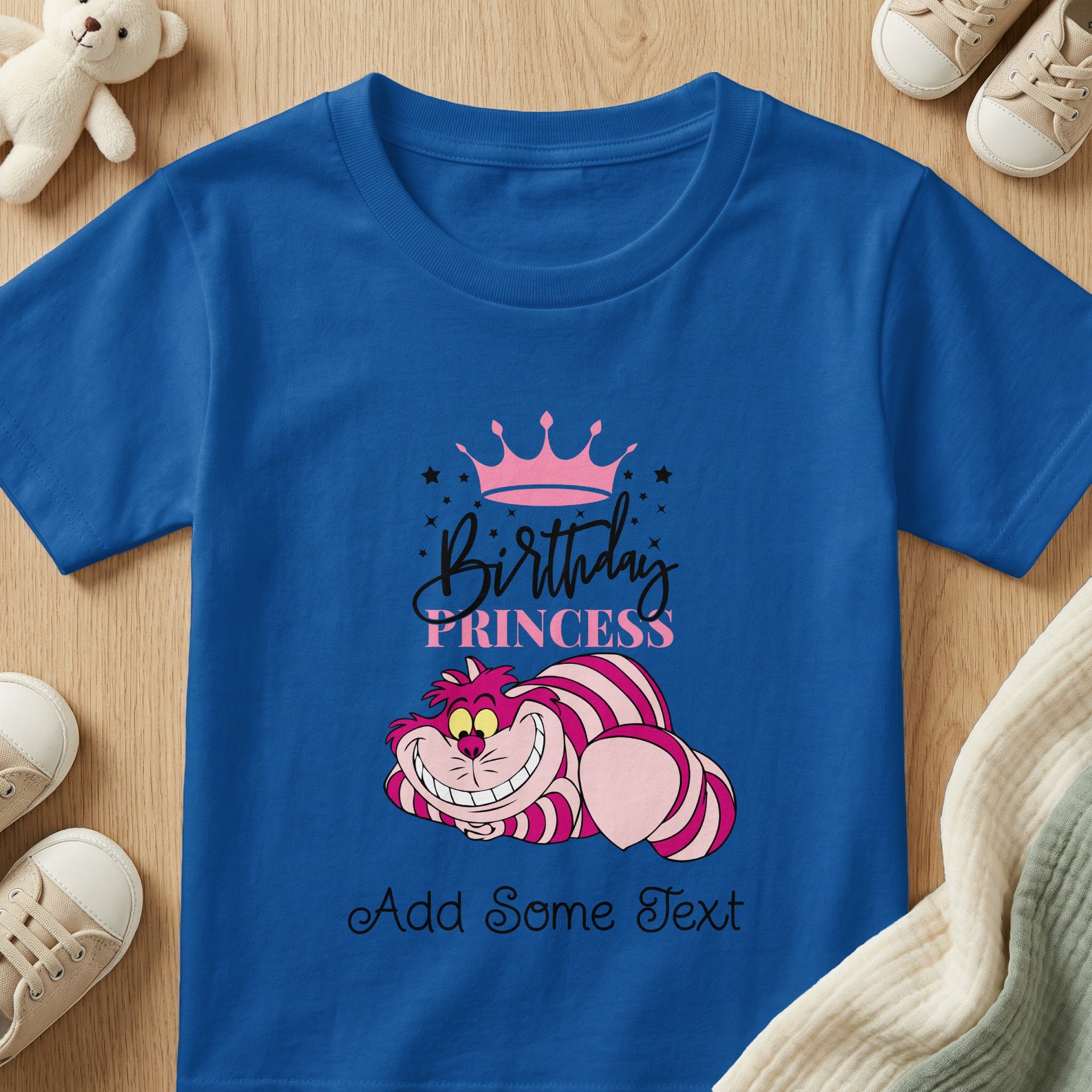 Royal blue t-shirt with pink crown, "Birthday Princess" text, and Cheshire Cat graphic.