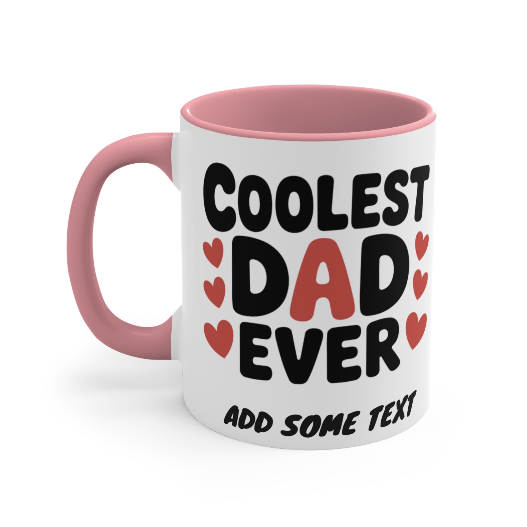 White mug with pink handle, "Coolest Dad Ever" and hearts design.