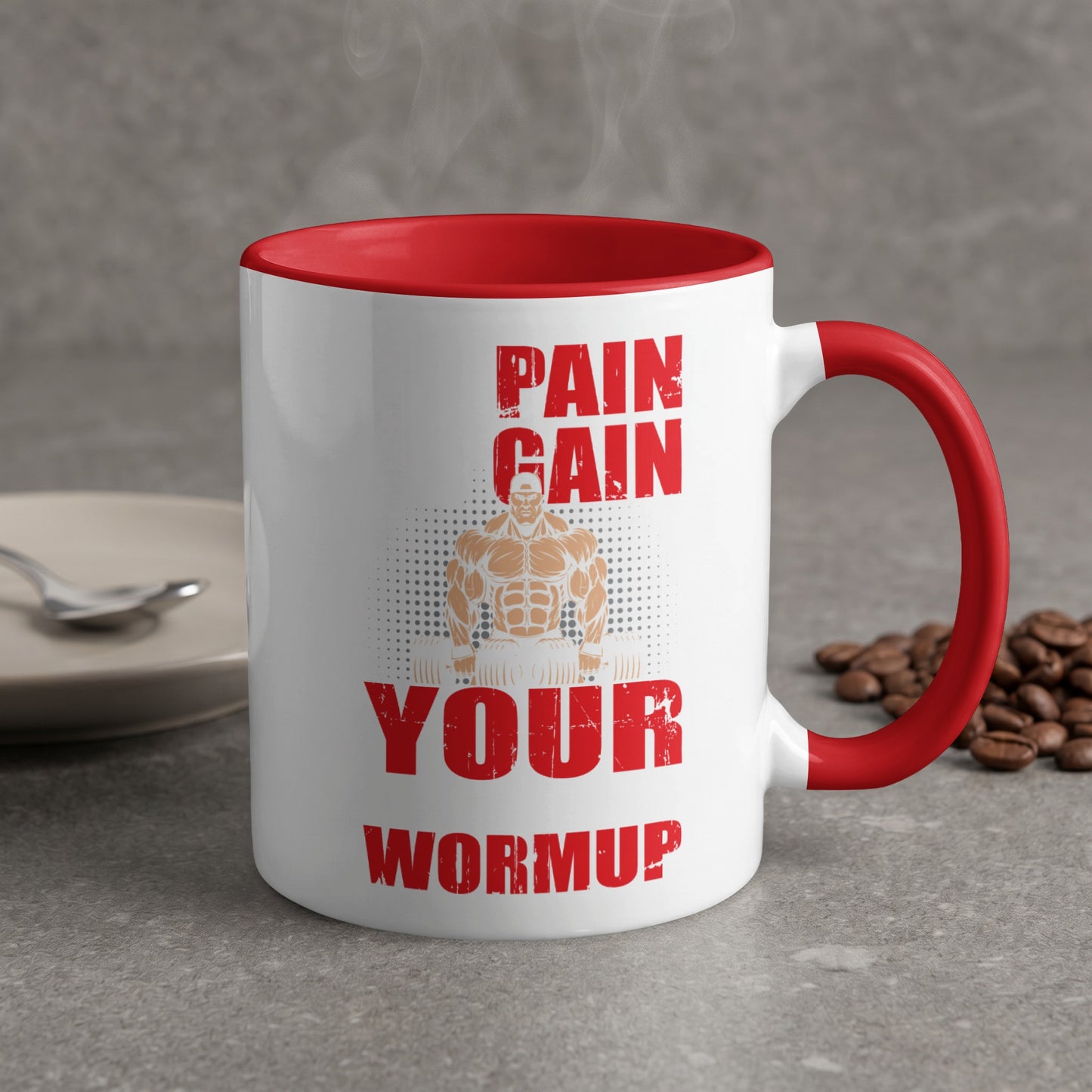 White mug with red rim and handle, featuring "Pain Gain Your Warmup" text and muscular man illustration.