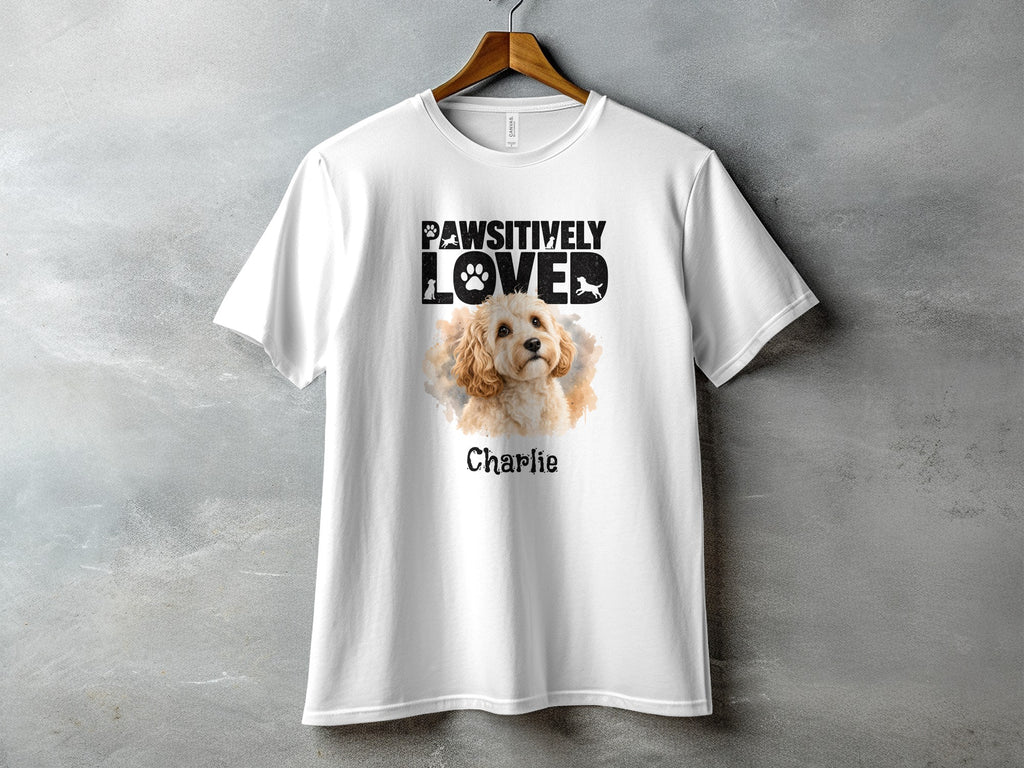 White t-shirt with "Pawsitively Loved" text and a dog illustration named Charlie.
