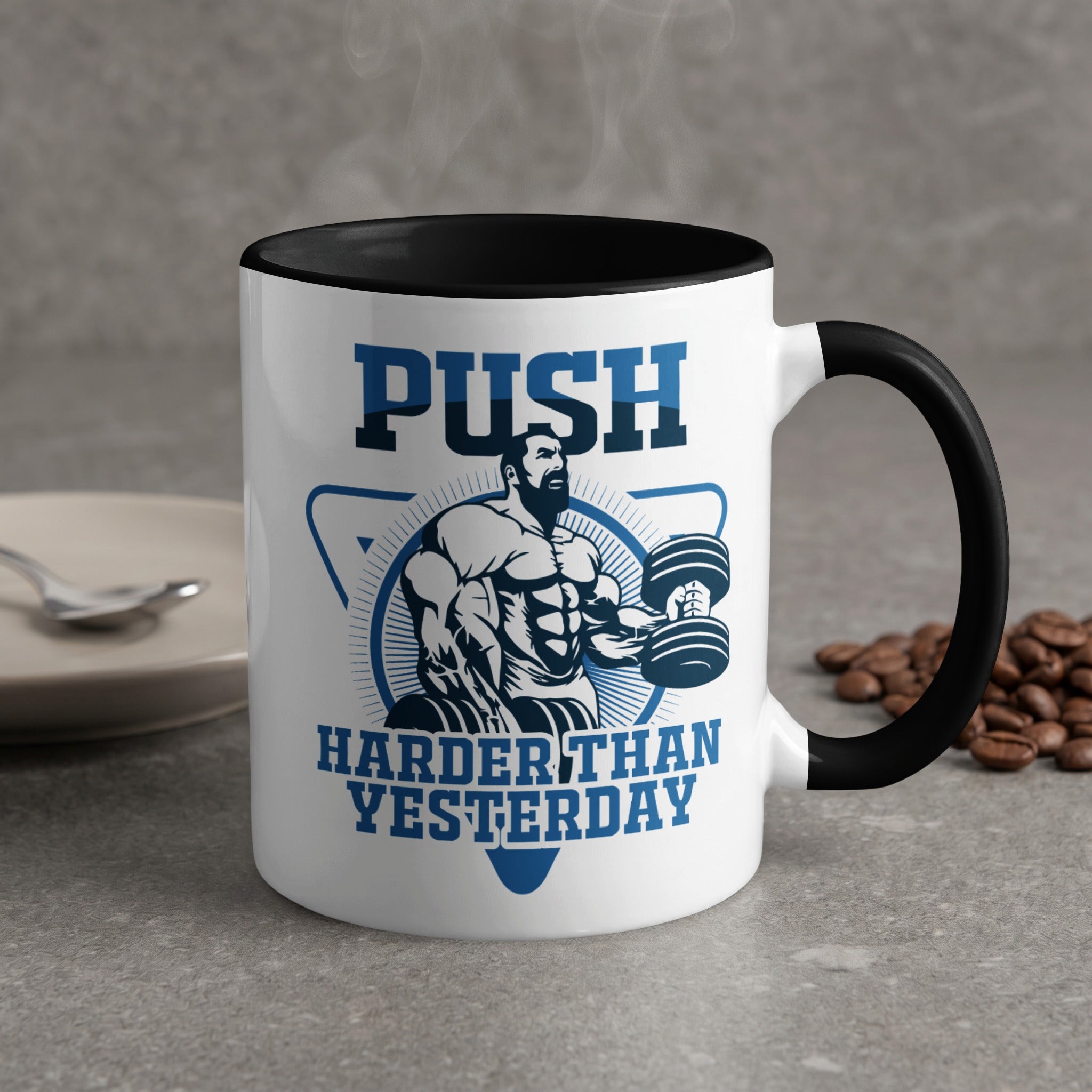 Mug with "PUSH HARDER THAN YESTERDAY" text and muscular man lifting weights.