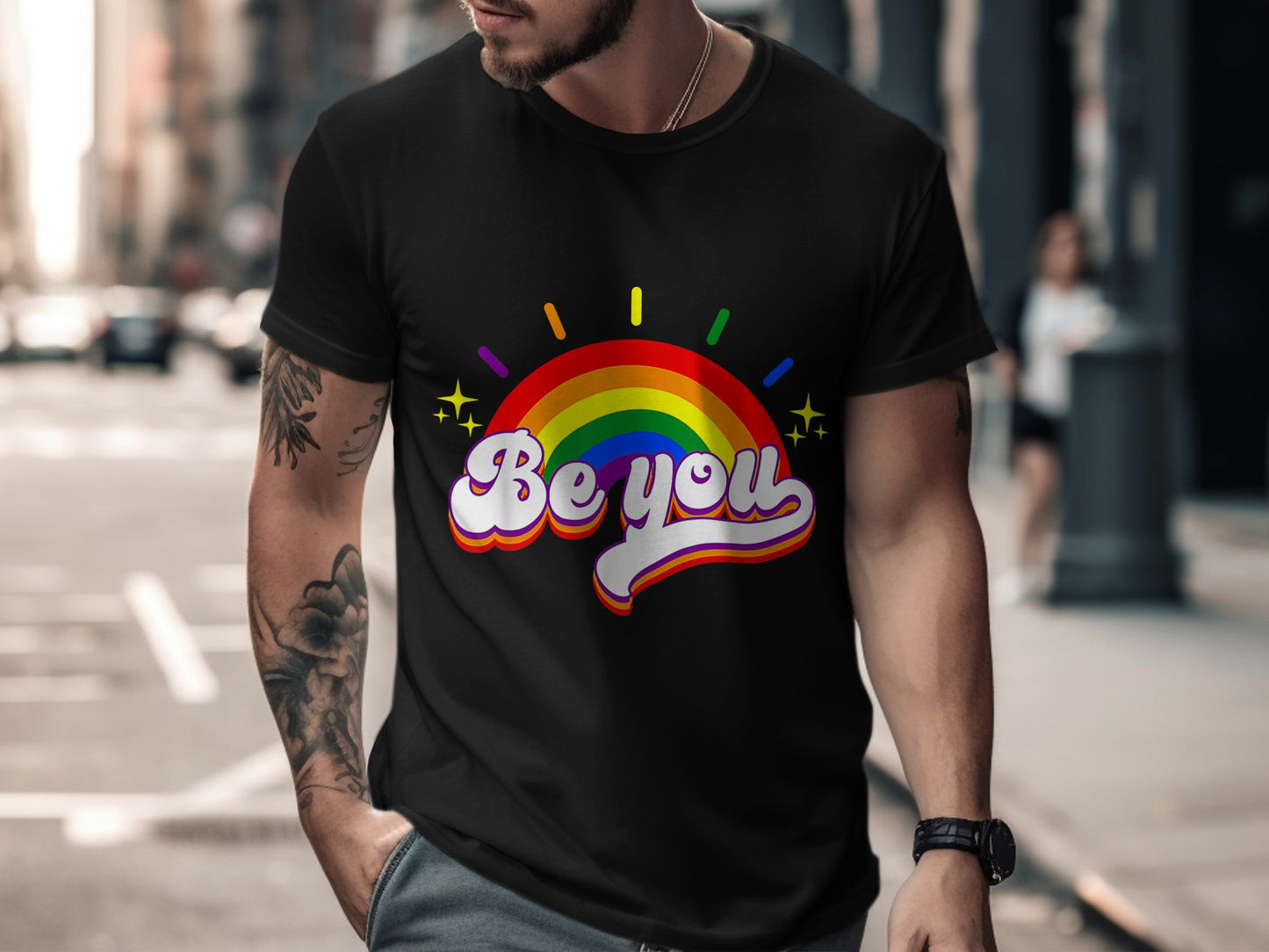 Black t-shirt with rainbow arc graphic and "Be you" text.