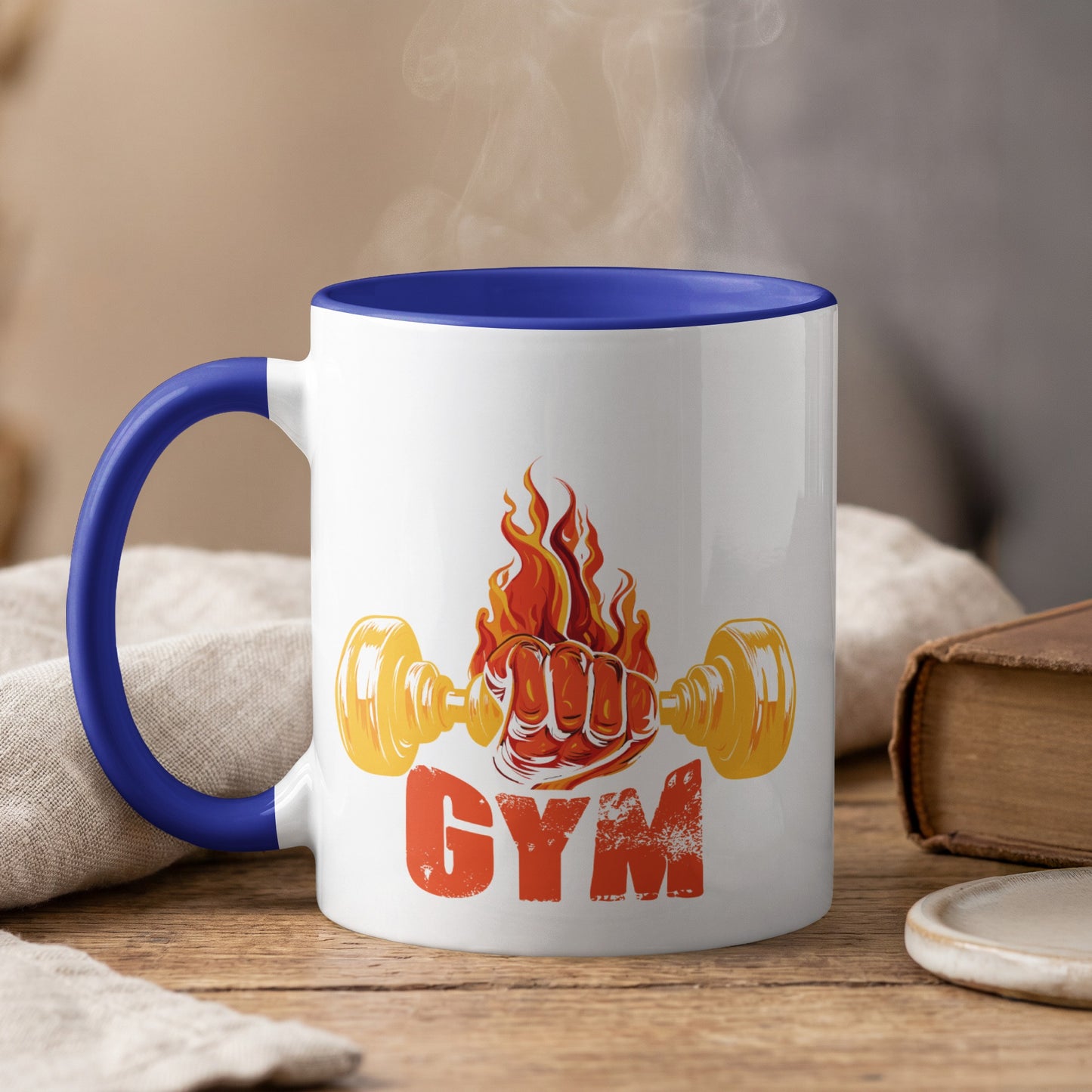White mug with blue handle, "GYM" text and flaming dumbbell graphic.