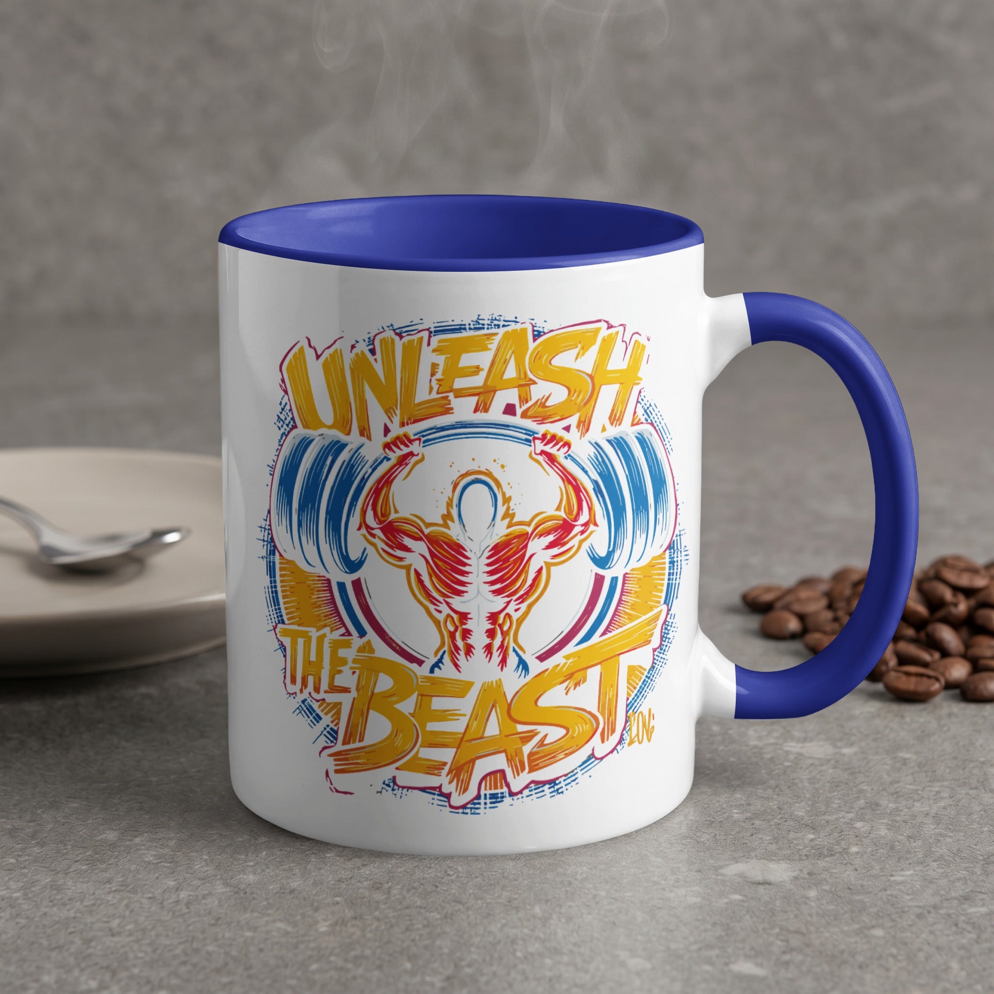 Mug with "Unleash the Beast" bodybuilding graphic and blue handle.