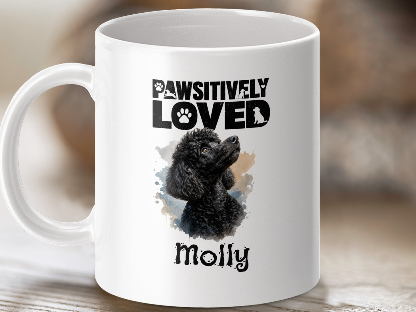 White mug with "PAWSITIVELY LOVED" and a black poodle illustration named Molly.