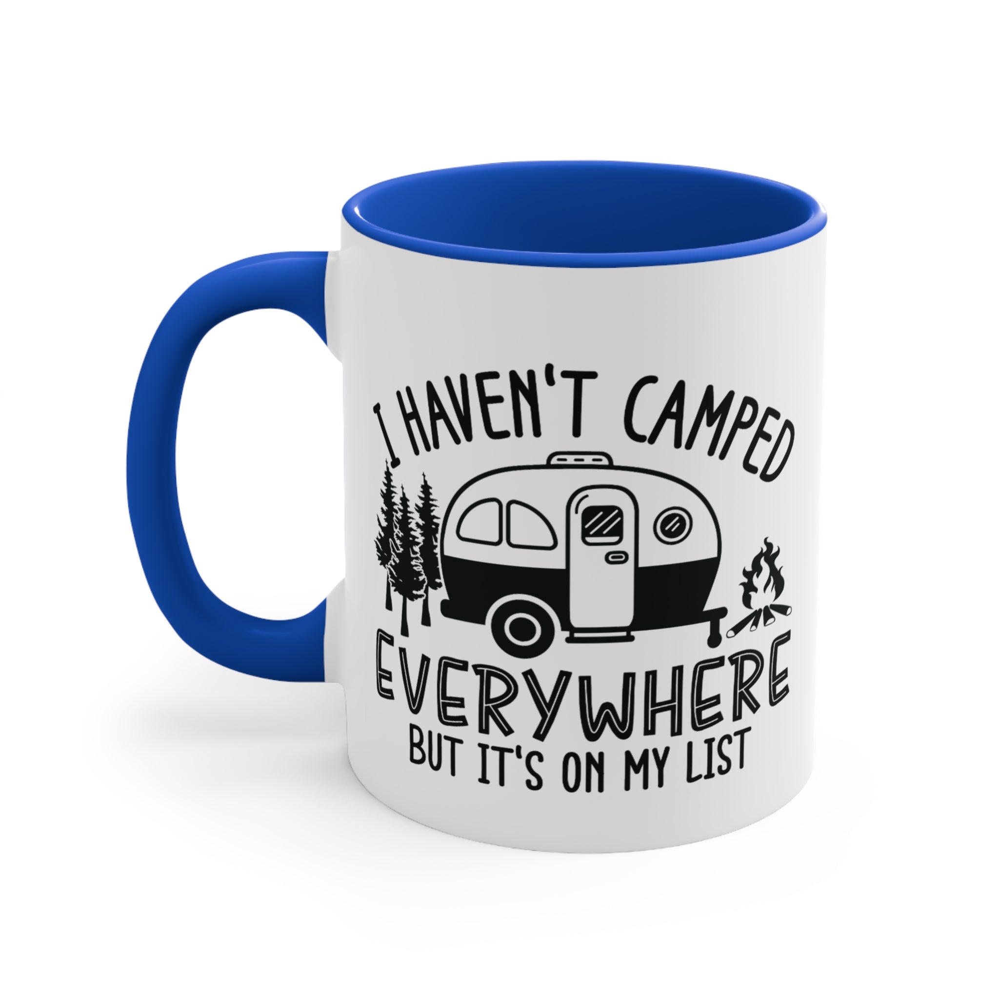 White mug with blue handle featuring a camper, trees, and campfire with text.