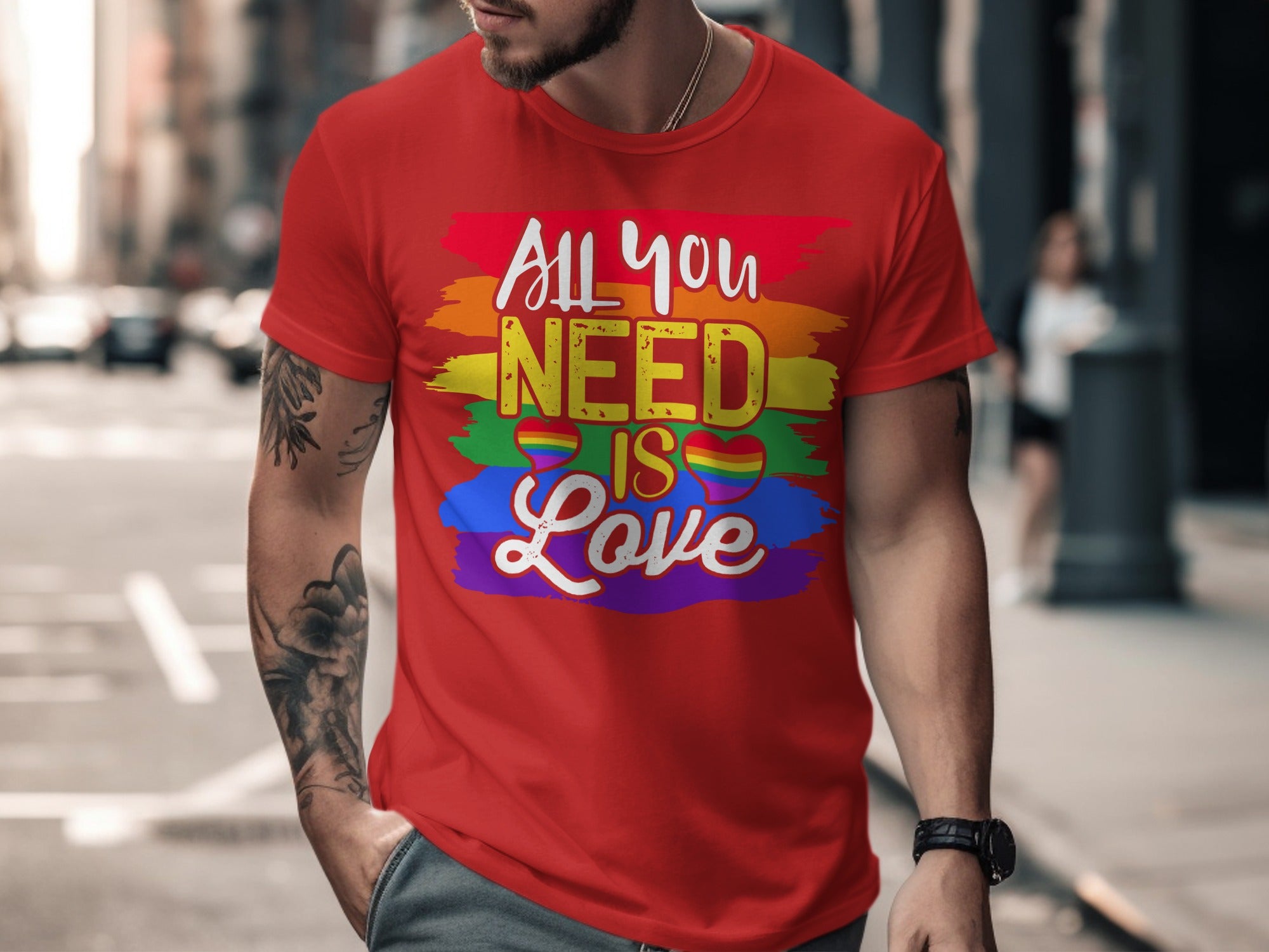 Red t-shirt with "All you NEED IS Love" in rainbow colors and hearts.