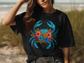 Black t-shirt with a floral blue crab graphic on the front.