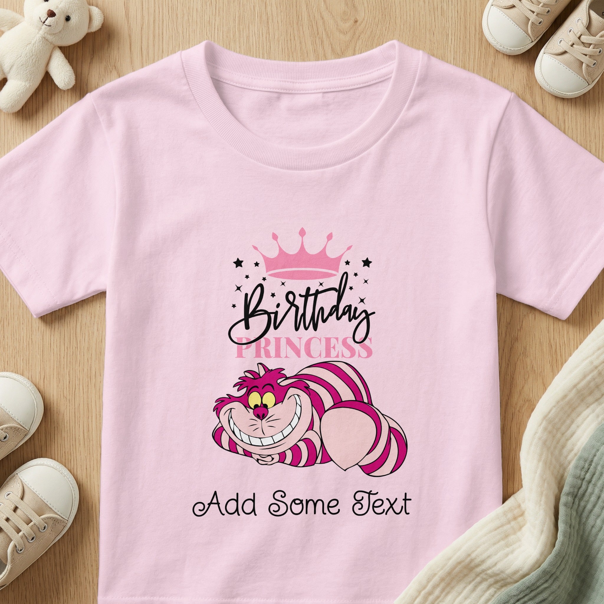 Pink t-shirt with Cheshire Cat, crown, and "Birthday Princess Add Some Text".