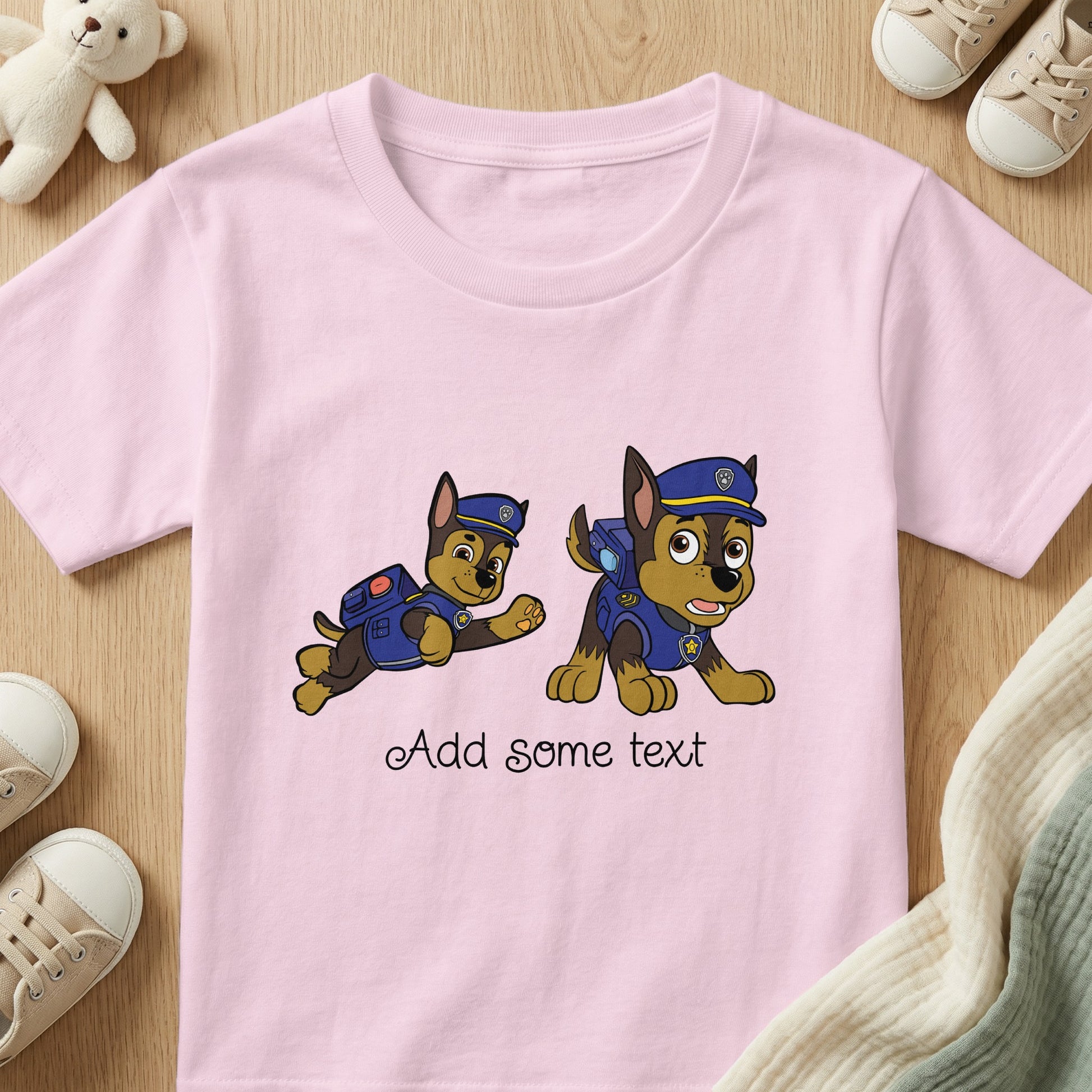 Pink t-shirt with two cartoon dogs in police uniforms and text "Add some text."