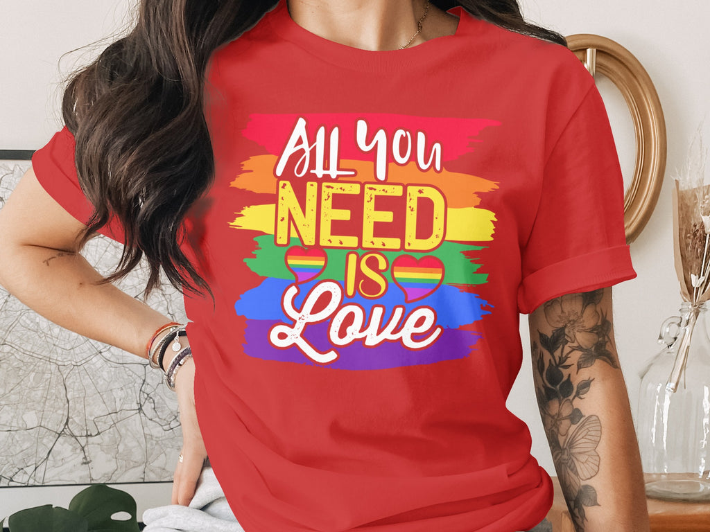 Red t-shirt with "All You Need Is Love" text and rainbow stripes and hearts.