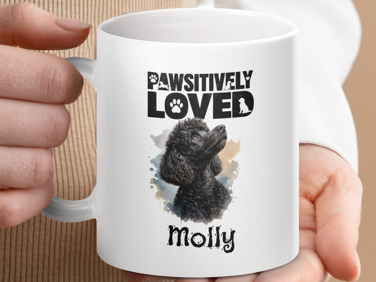 White mug with "Pawsitively Loved Molly" and a black poodle illustration.