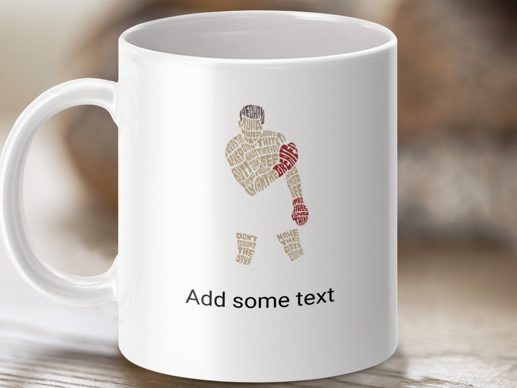 White mug with abstract text art of a boxer and motivational phrases.