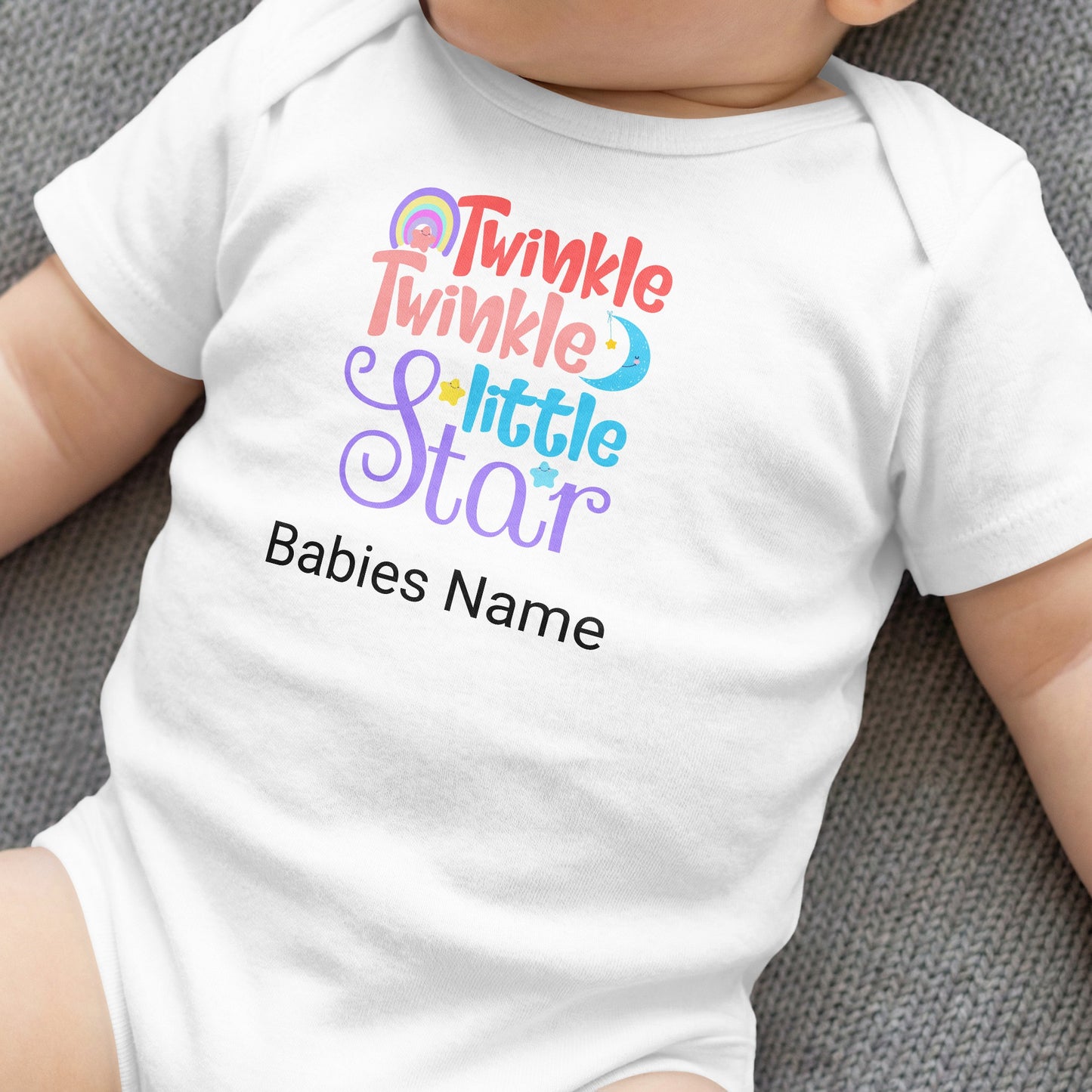 White baby onesie with "Twinkle twinkle little star" and "Babies Name" text.