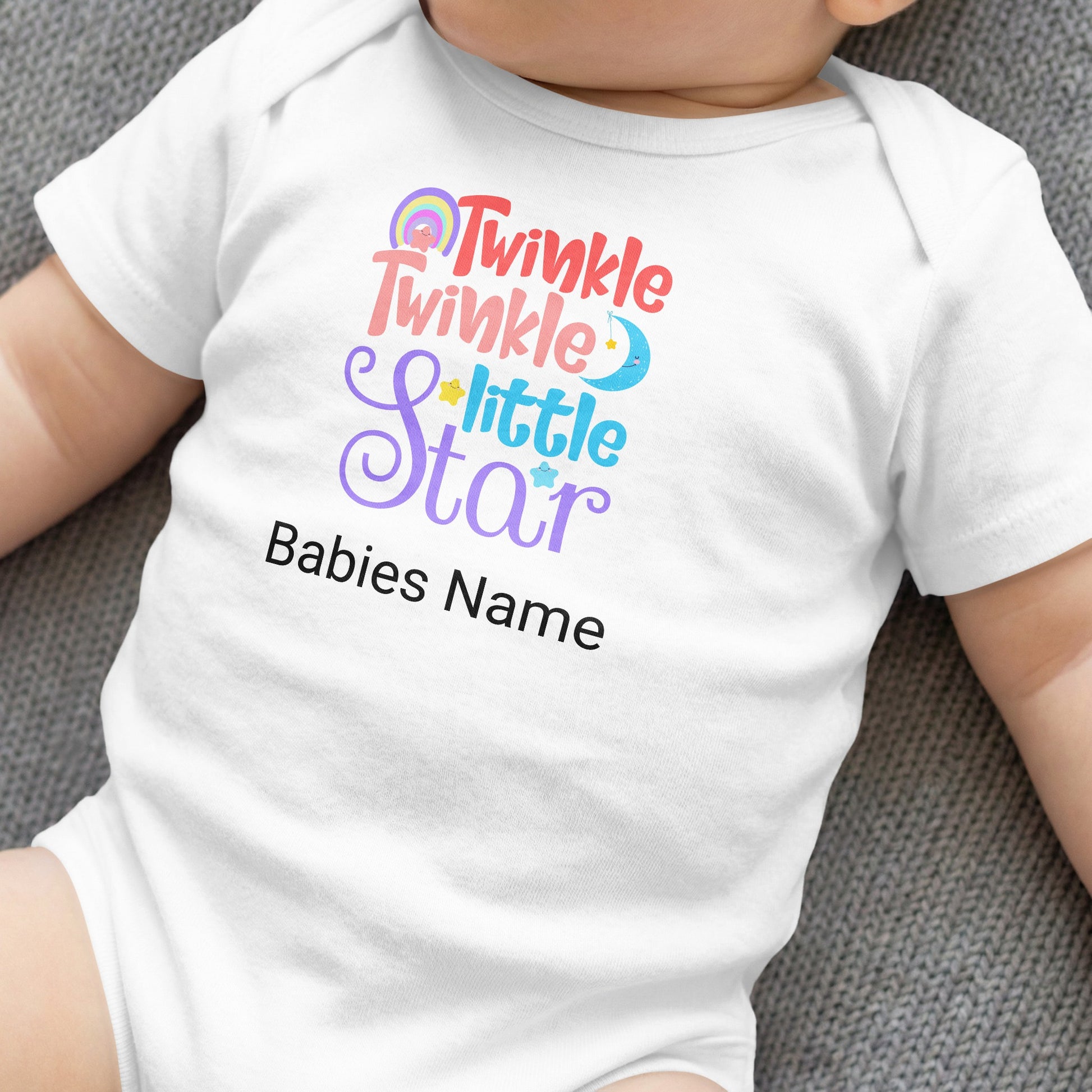 White baby onesie with "Twinkle twinkle little star" and "Babies Name" text.