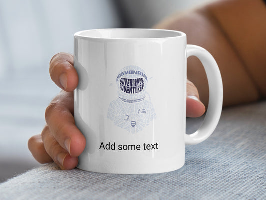 White mug with astronaut helmet design made of space-themed words.