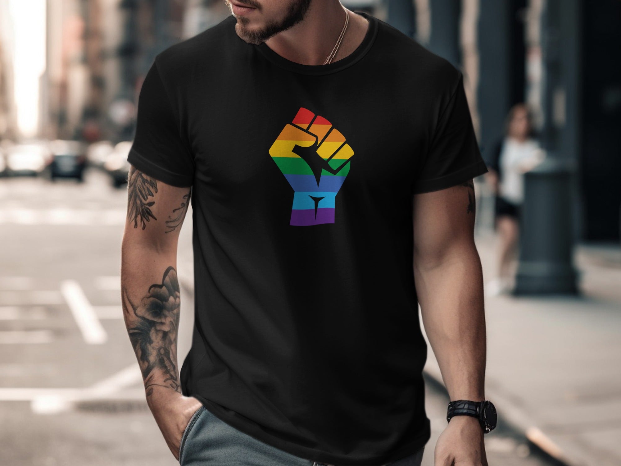 Black t-shirt with rainbow fist graphic on chest.