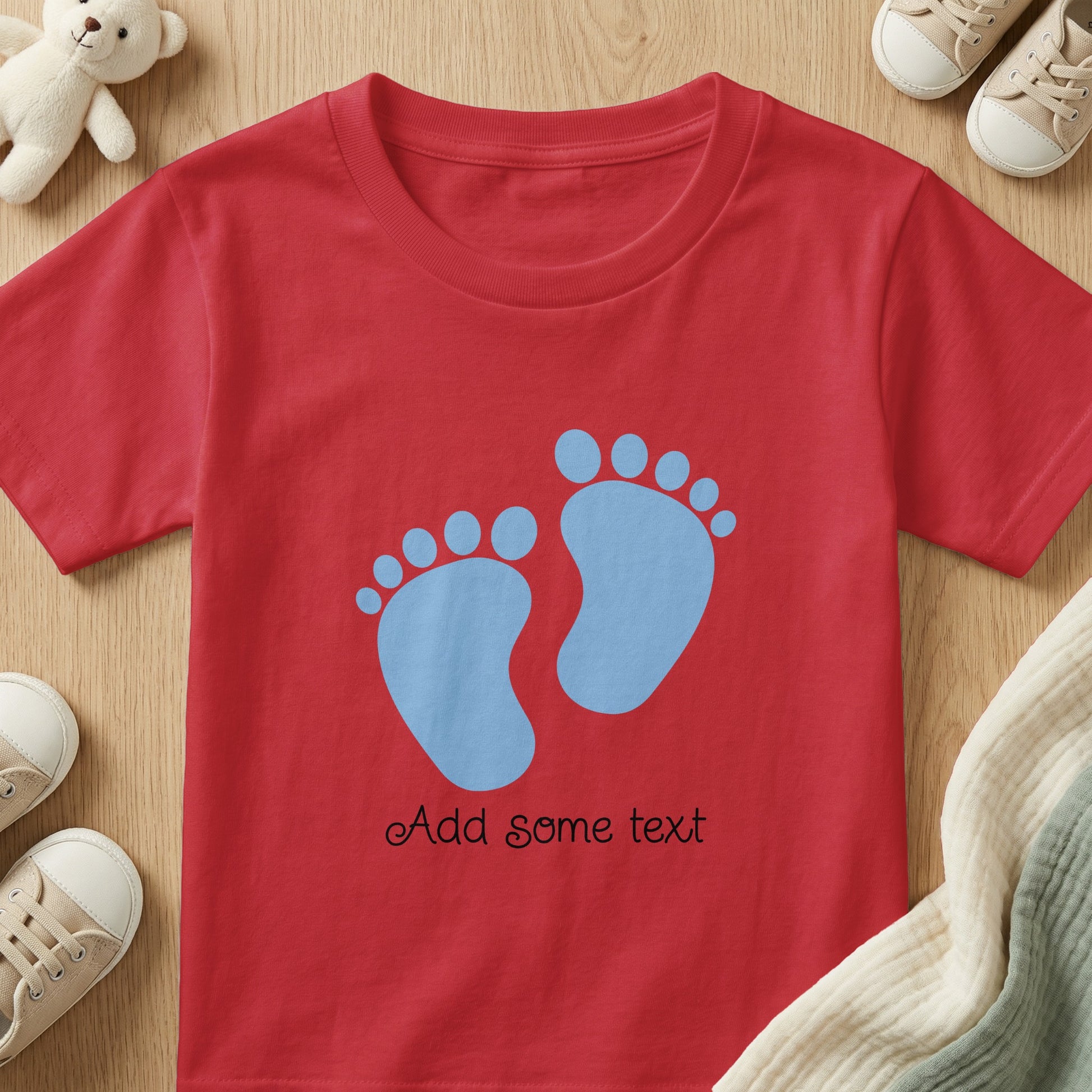 Red t-shirt with blue baby footprints and "Add some text" personalization.