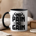 White mug with black interior and handle, featuring "NO PAIN NO GAIN" text.
