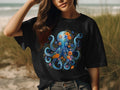 Black t-shirt with a vibrant blue floral octopus design on the chest.