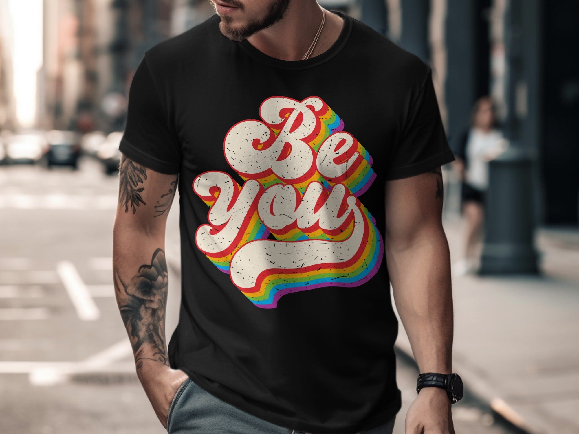 Black t-shirt with rainbow text that says "Be You".