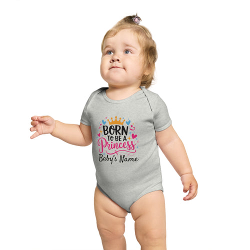 Baby girl in gray onesie with "Born to be a Princess" text.
