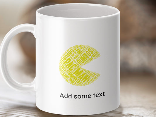 White mug with Pac-Man shape formed from game-related words and "Add some text."