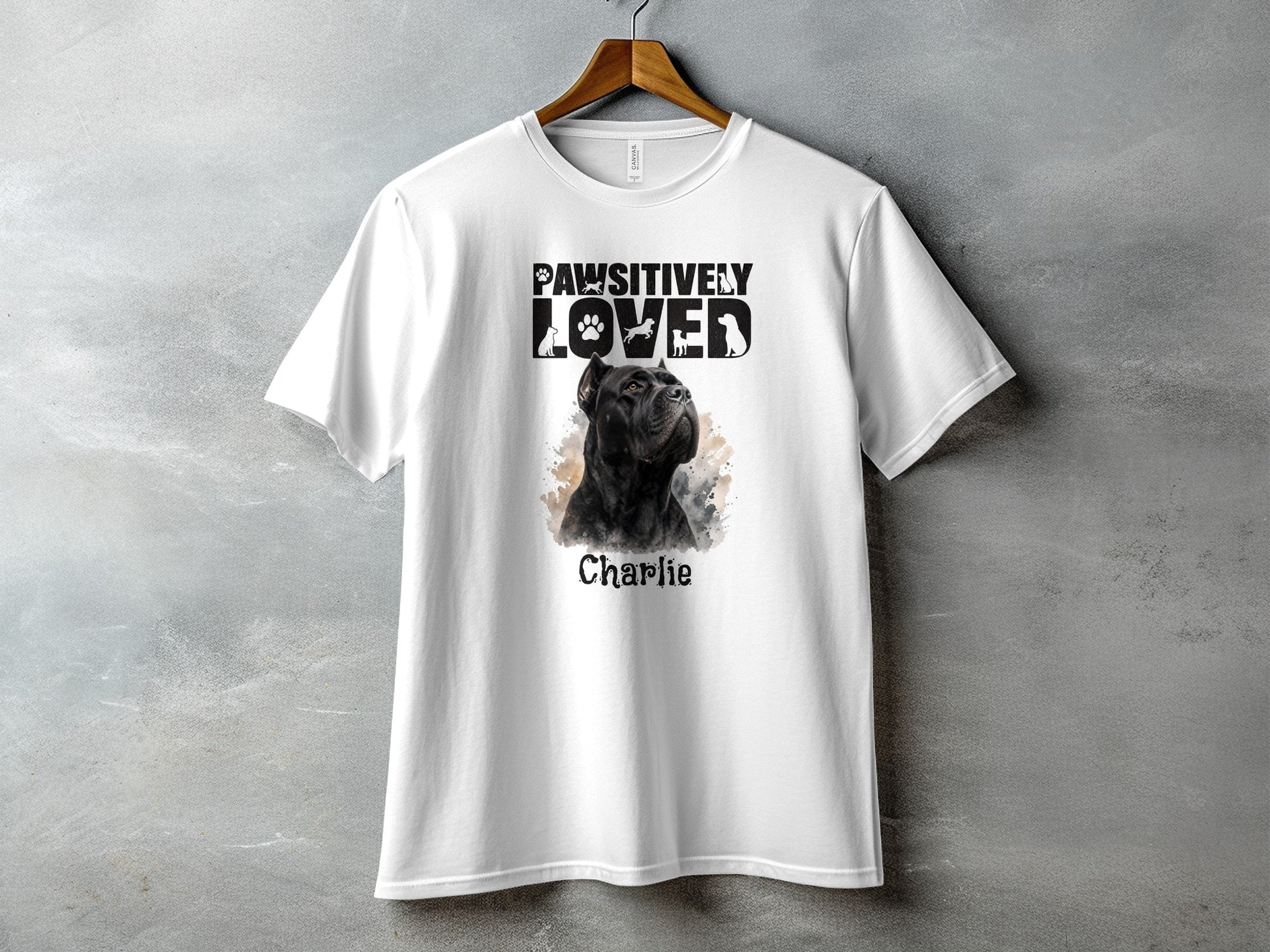 White t-shirt with black dog graphic and "Pawsitively Loved Charlie" text.