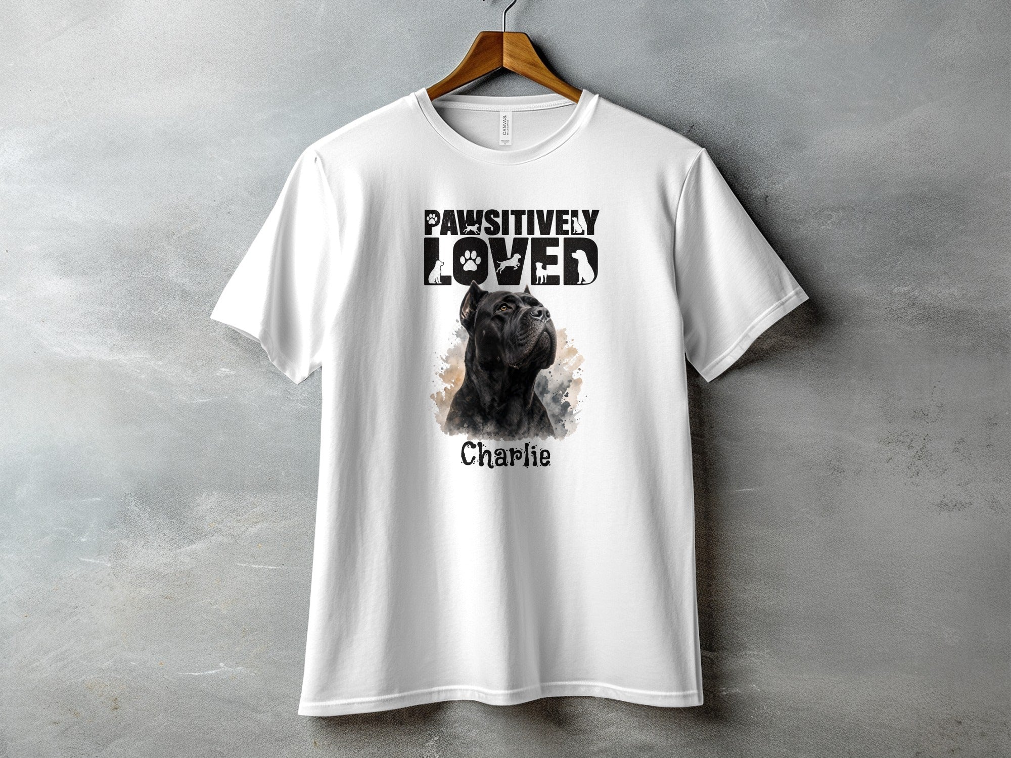 White t-shirt with black dog graphic and "Pawsitively Loved Charlie" text.