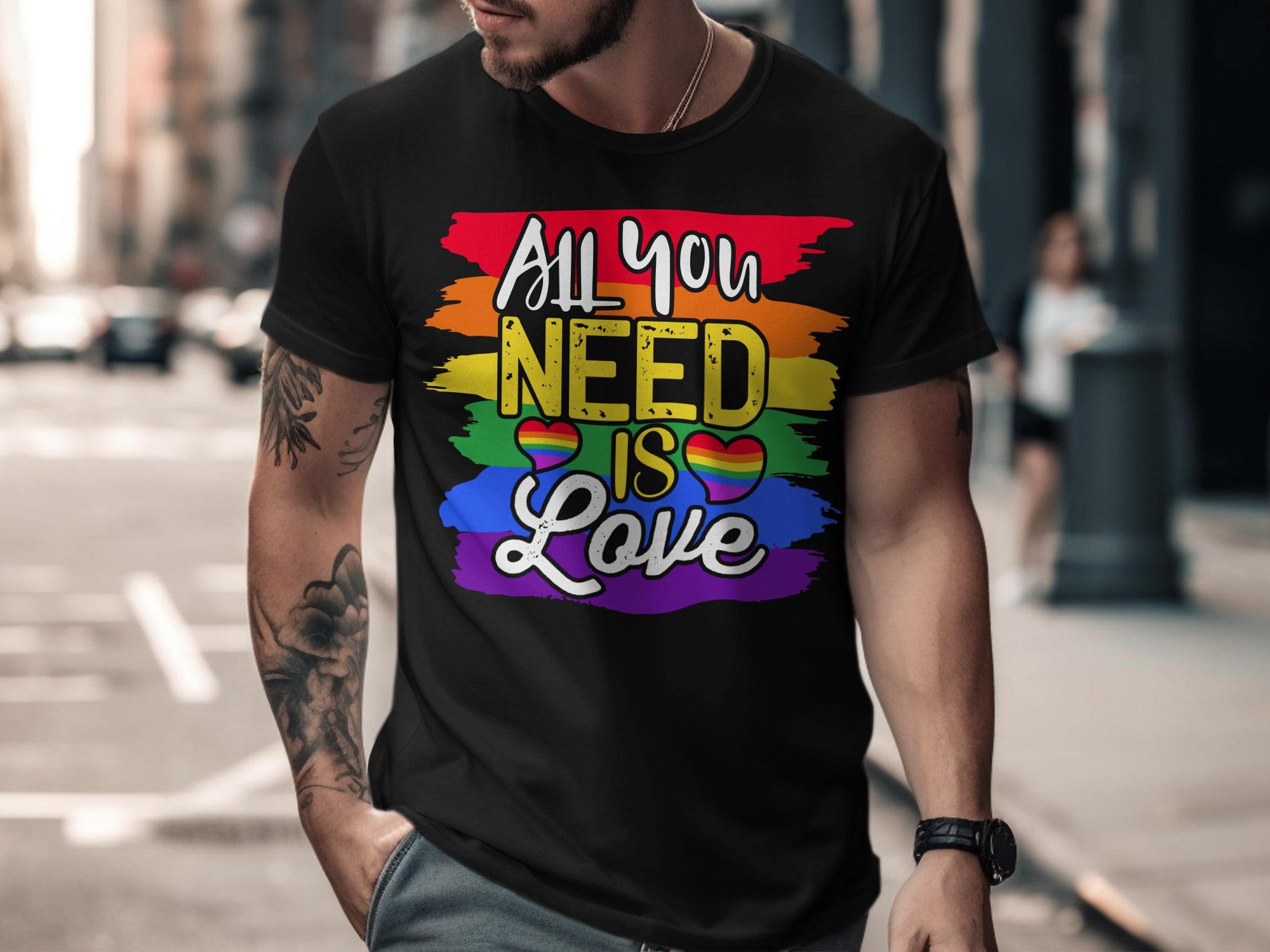 Black t-shirt with rainbow stripes and text "All you NEED IS Love".