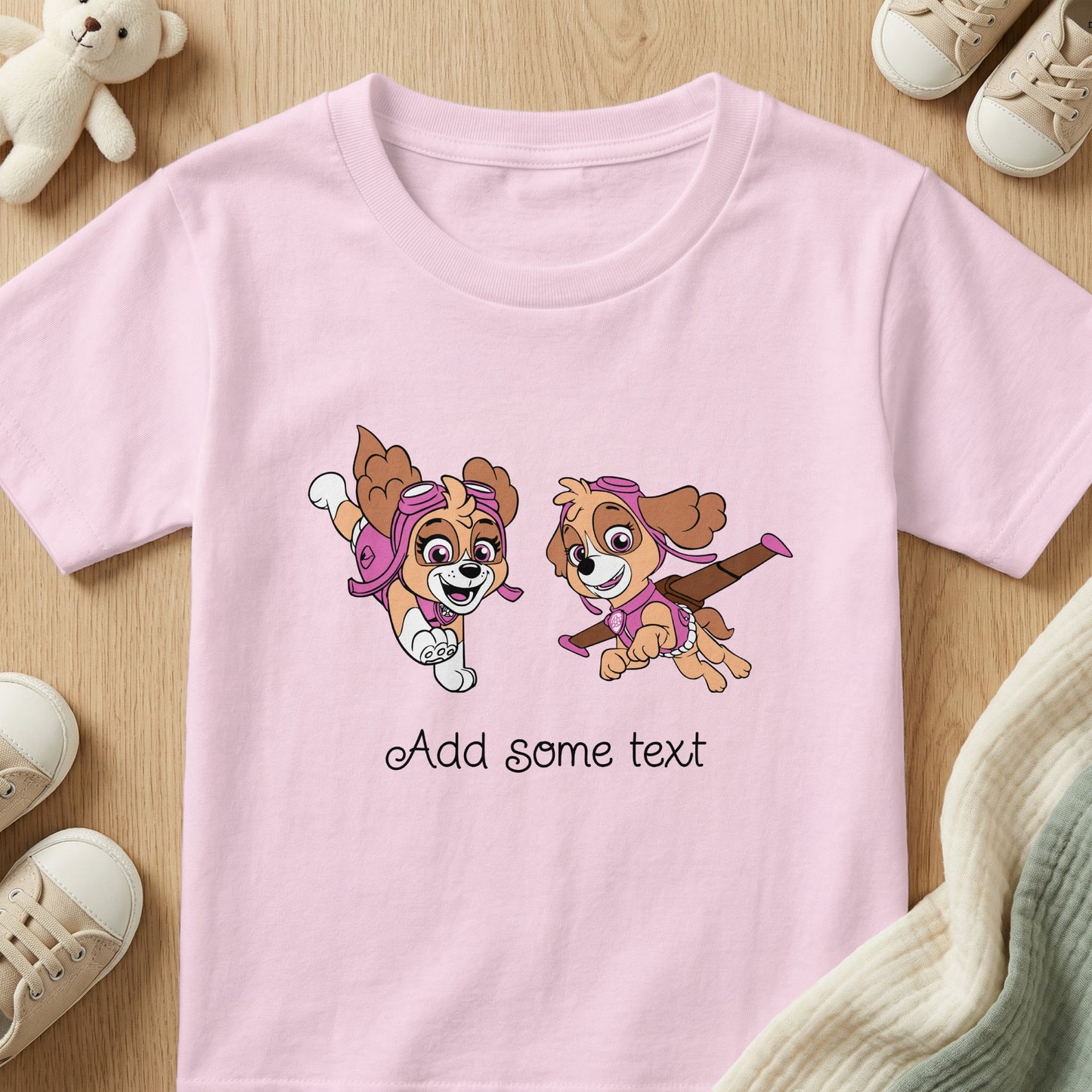 Pink t-shirt with two cartoon dogs and "Add some text."