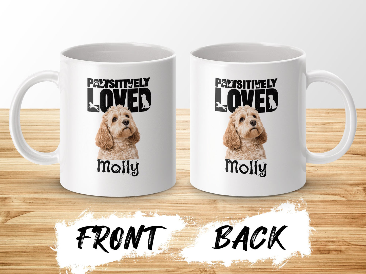 Two white mugs with dog designs reading "PAWSITIVELY LOVED" and "Molly".