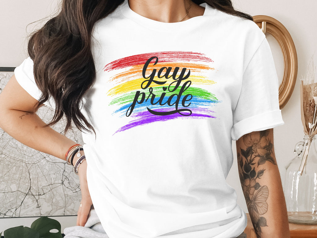 White t-shirt with rainbow brush strokes and "Gay pride" text.