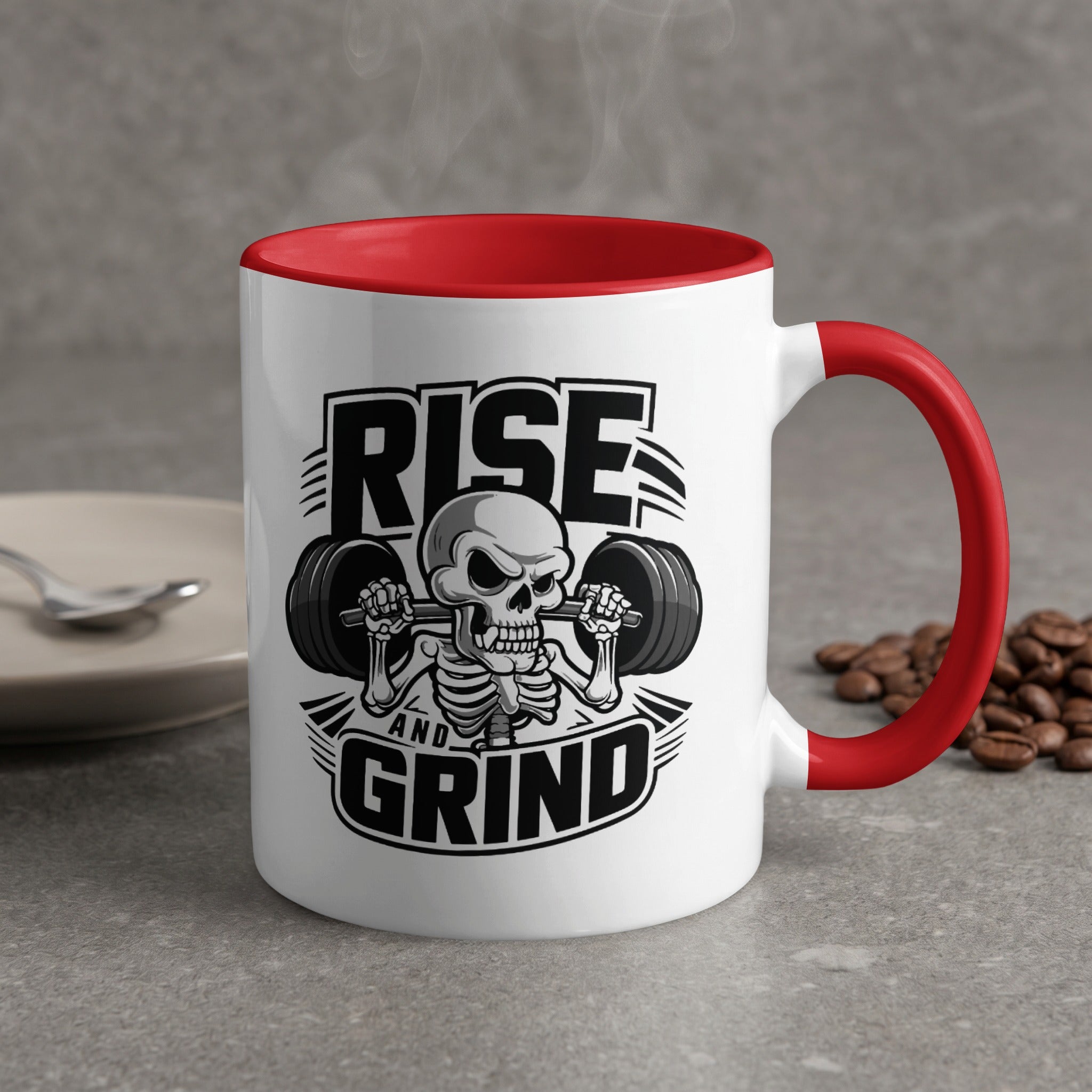White mug with red handle, featuring a skeleton lifting weights and "RISE AND GRIND" text.