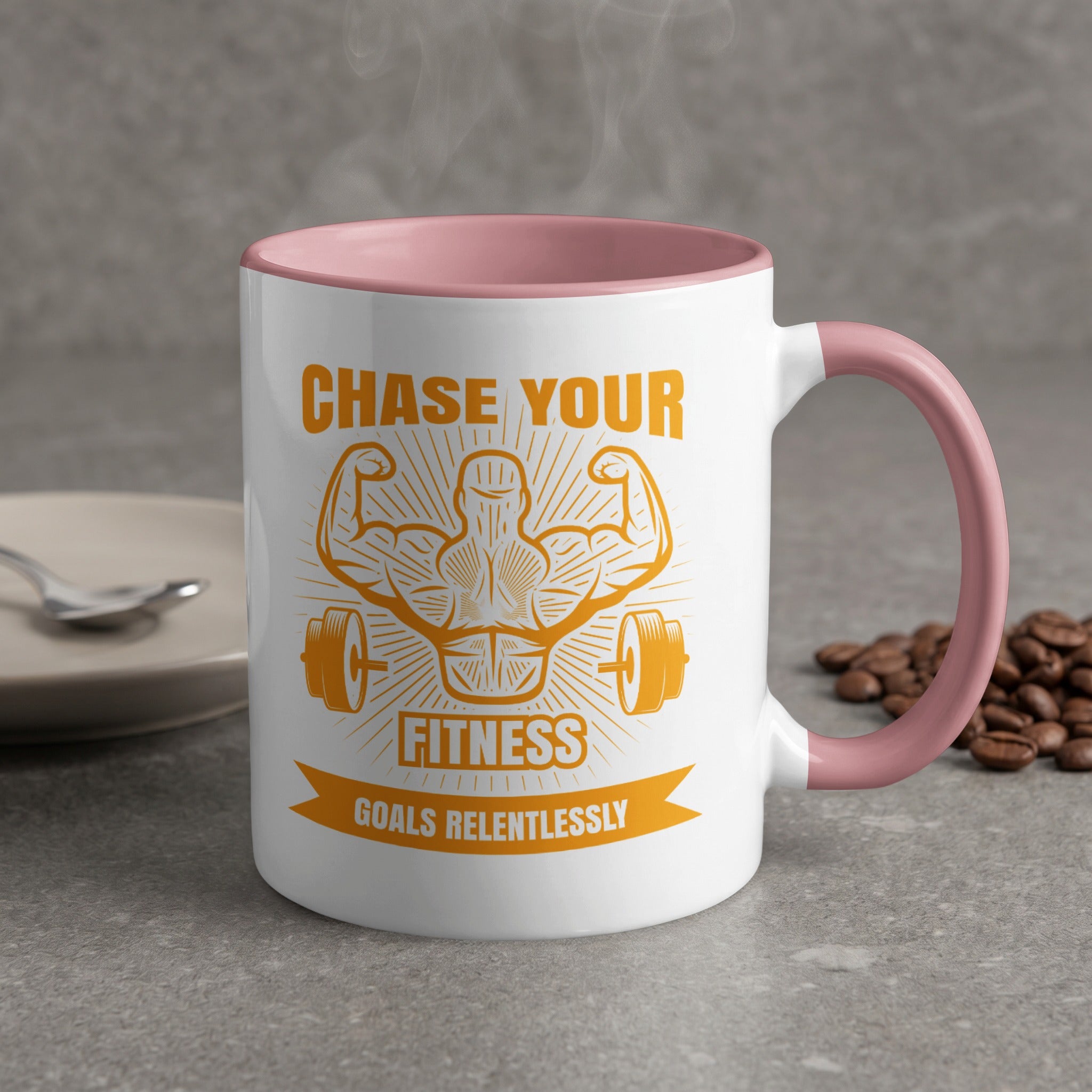 White mug with pink rim, featuring "CHASE YOUR FITNESS GOALS RELENTLESSLY" text and arm muscle graphic.