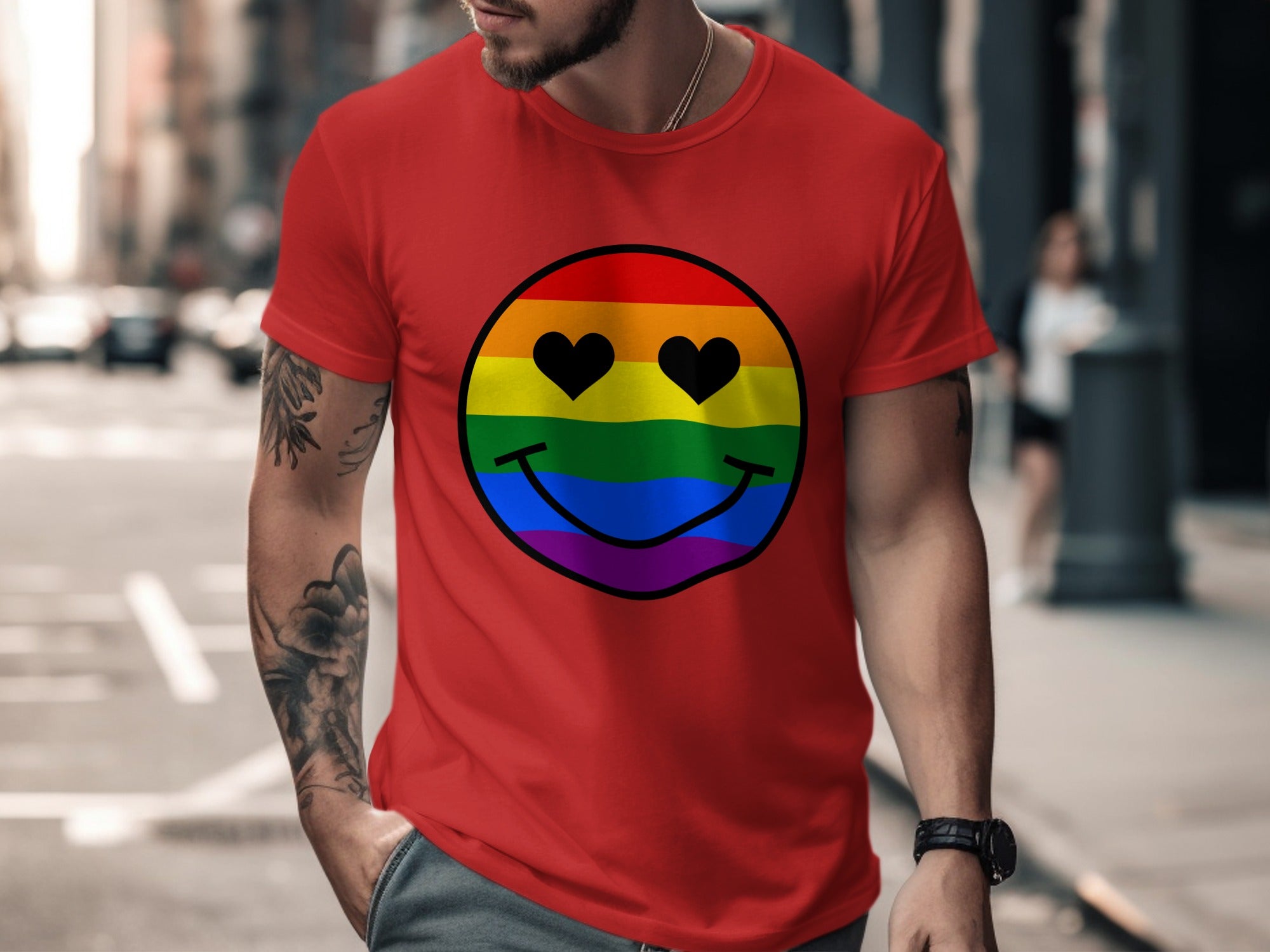 Red t-shirt with a rainbow smiley face with heart eyes.