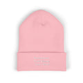 Pink knitted beanie with personalized front text.
