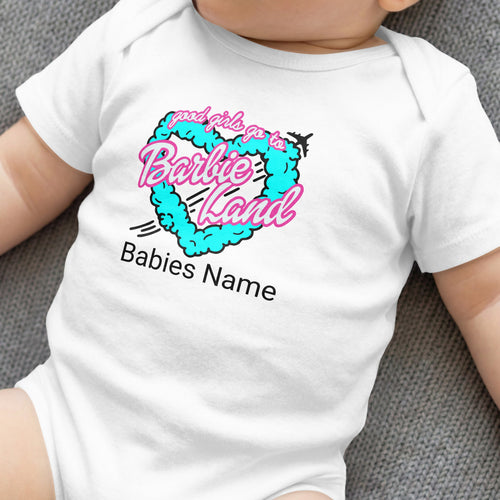 White baby onesie with "good girls go to Barbie Land" heart graphic.