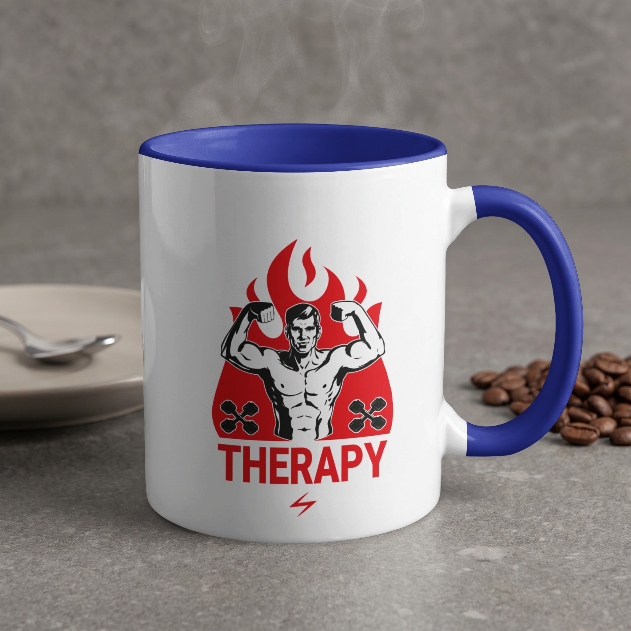 White mug with blue rim and handle, featuring a muscular man flexing and the word "THERAPY".