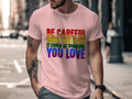 Pink t-shirt featuring rainbow text: "BE CAREFUL WHO YOU HATE IT COULD BE SOMEONE YOU LOVE".