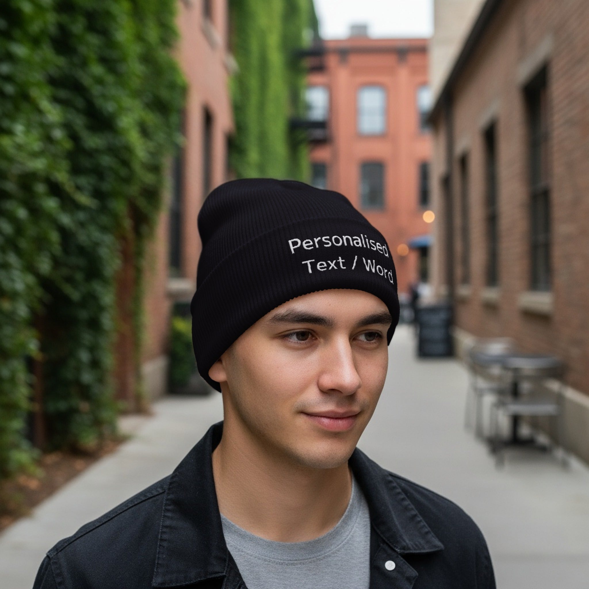 Black beanie with "Personalised Text / Word" embroidered on it.