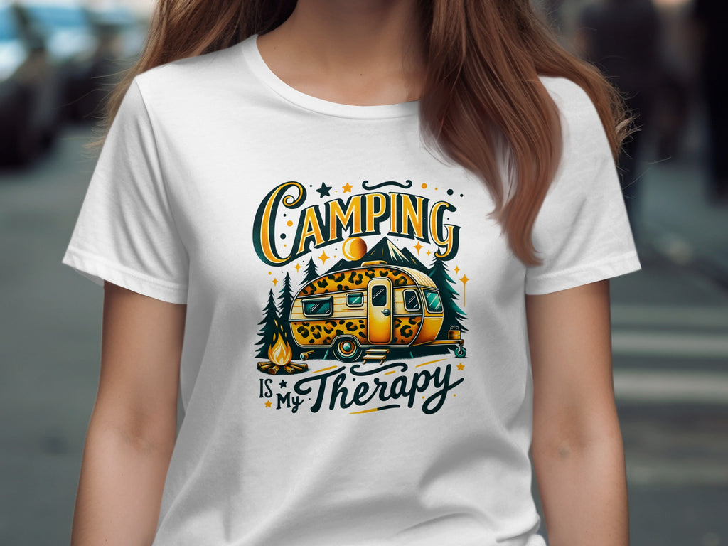 White t-shirt with text "Camping is My Therapy" and camper graphic.