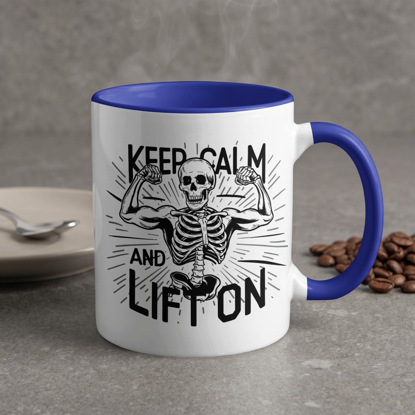 White mug with blue handle, skeleton flexing biceps, text "Keep Calm and Lift On".
