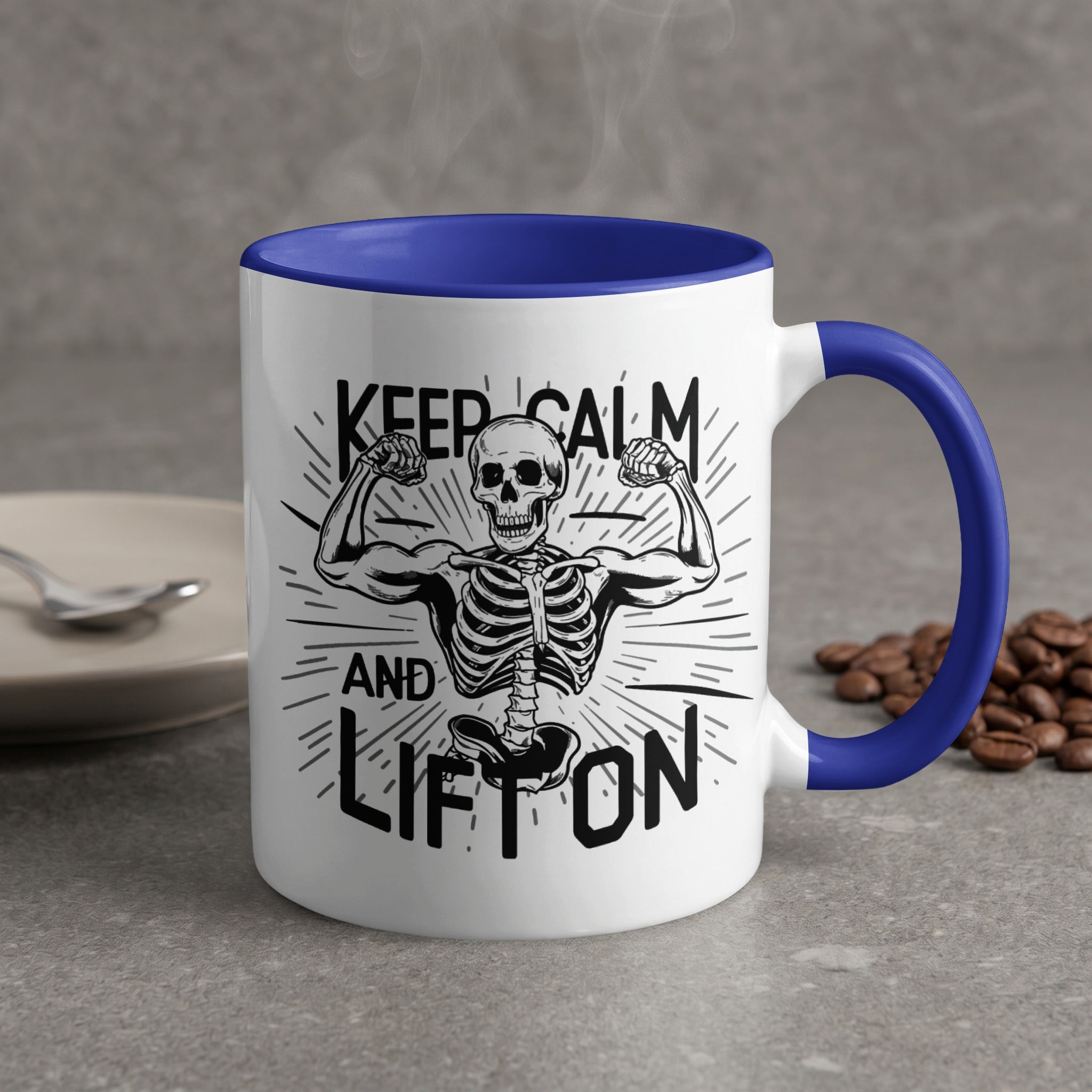 White mug with blue handle, skeleton flexing biceps, text "Keep Calm and Lift On".