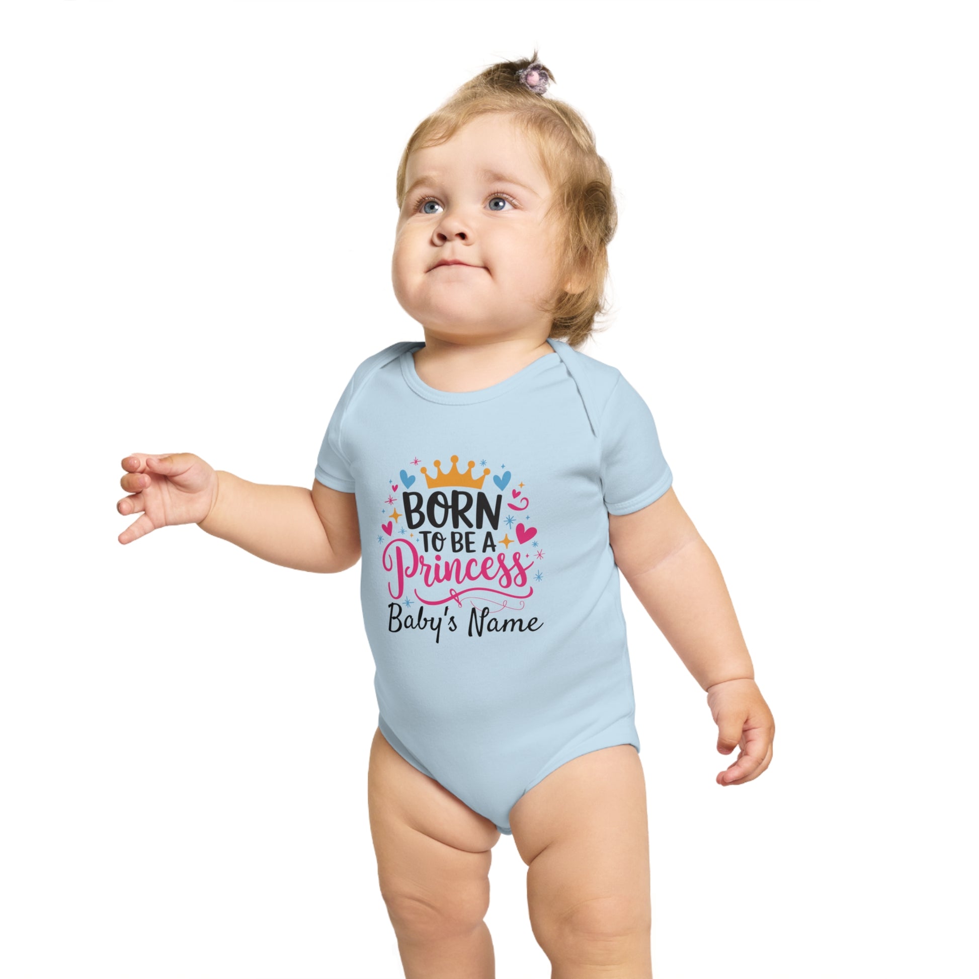 Baby girl in light blue onesie with "Born to be a Princess" text and crown.