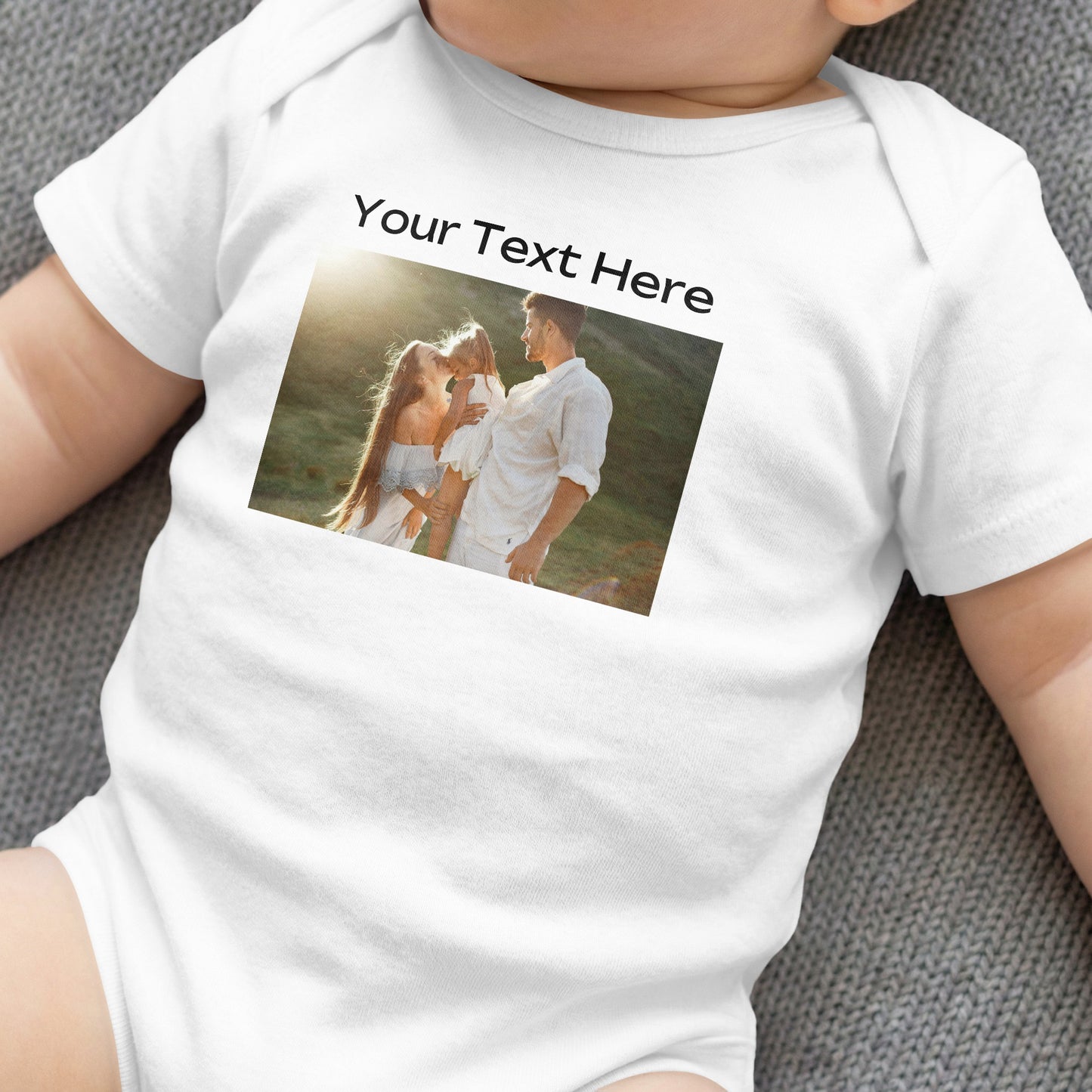 White baby onesie with custom text and a family photo on the front.