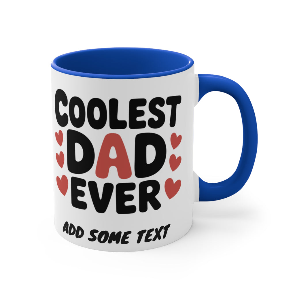 White mug with blue handle, "Coolest Dad Ever" text and red hearts.