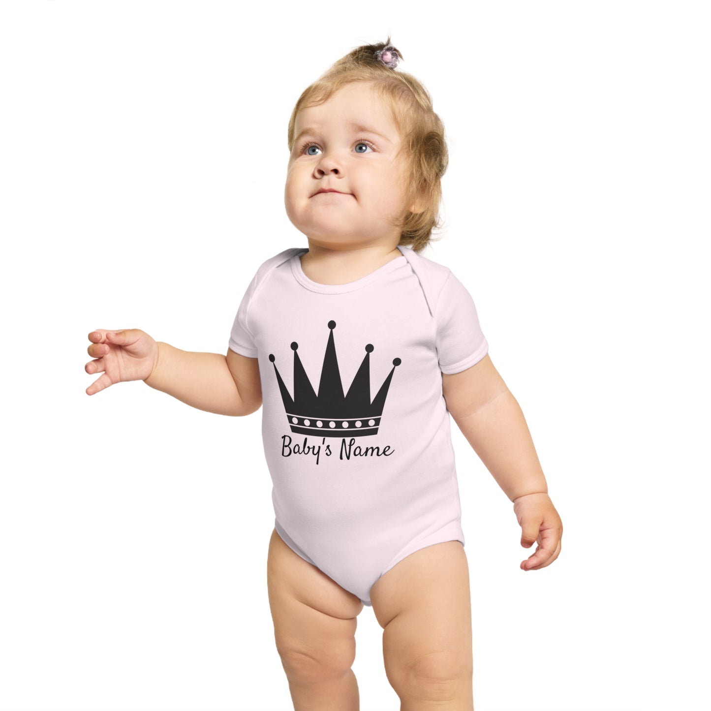 Baby wearing a light pink bodysuit with a black crown and "Baby's Name" text.