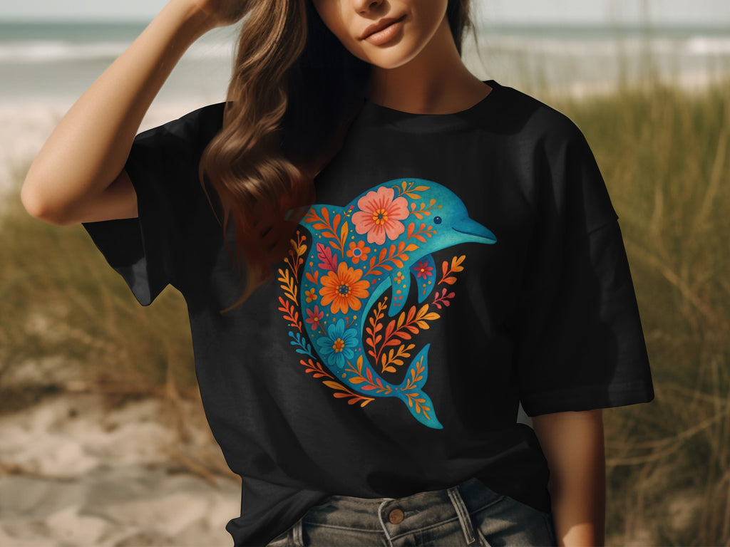 Black t-shirt with a floral dolphin design in blue, orange, and pink.