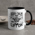 White mug with black rim featuring a skeleton flexing and text "Keep Calm and Lift On".
